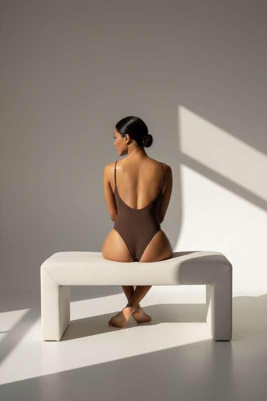 Confident Woman in Brown Bodysuit